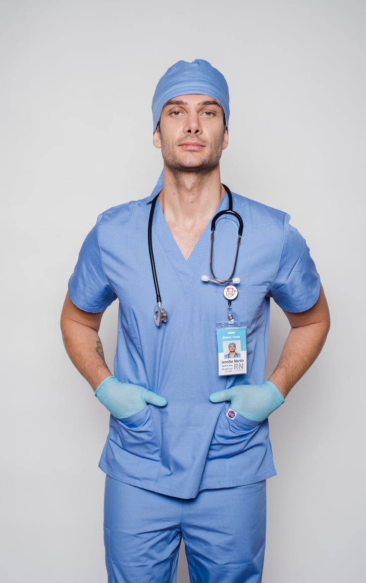 Serious doctor in uniform with stethoscope