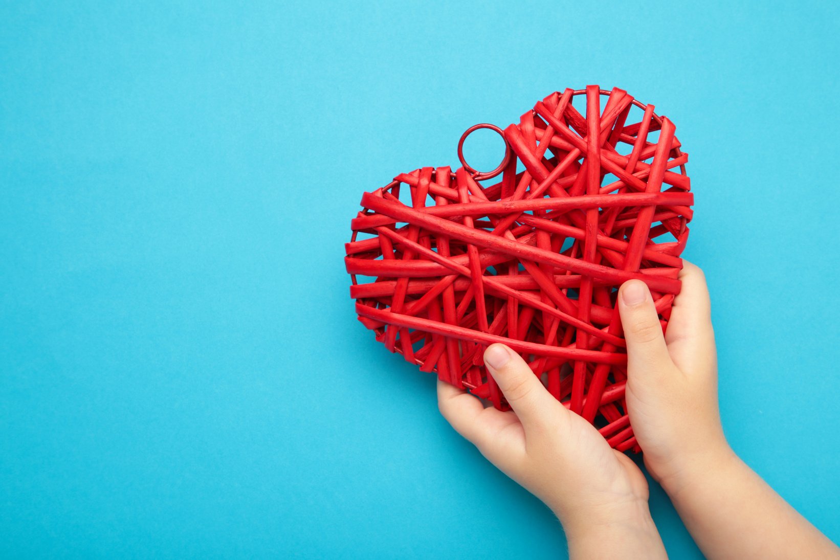 Child hands holding red heart for share Donate. Health care pediatric. World heart day, world health day.